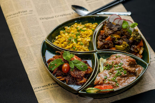 dish with 4 dividers of 4 different types of food 